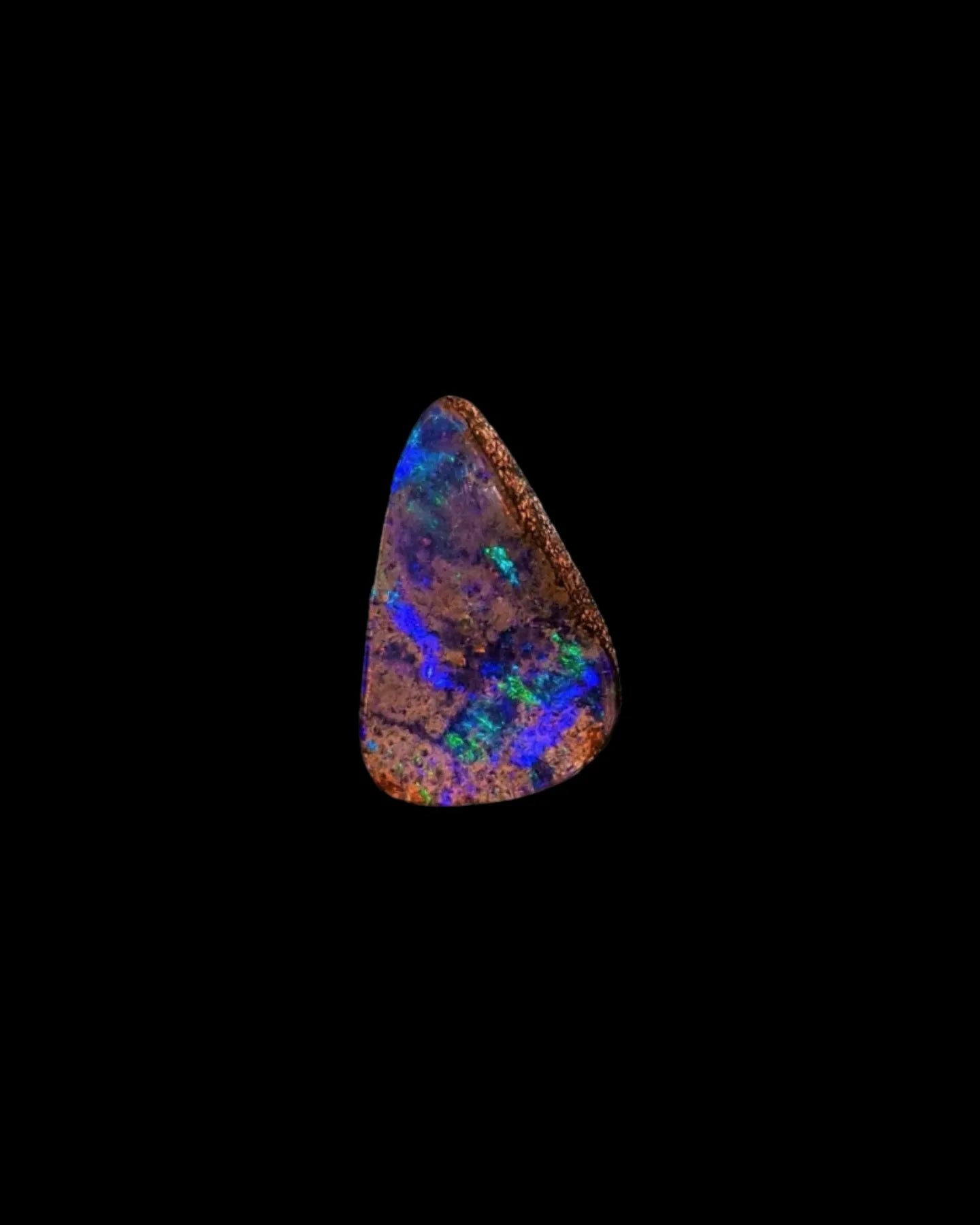 A 2024 small triangular(ish) shape boulder opal from Winton in Queensland